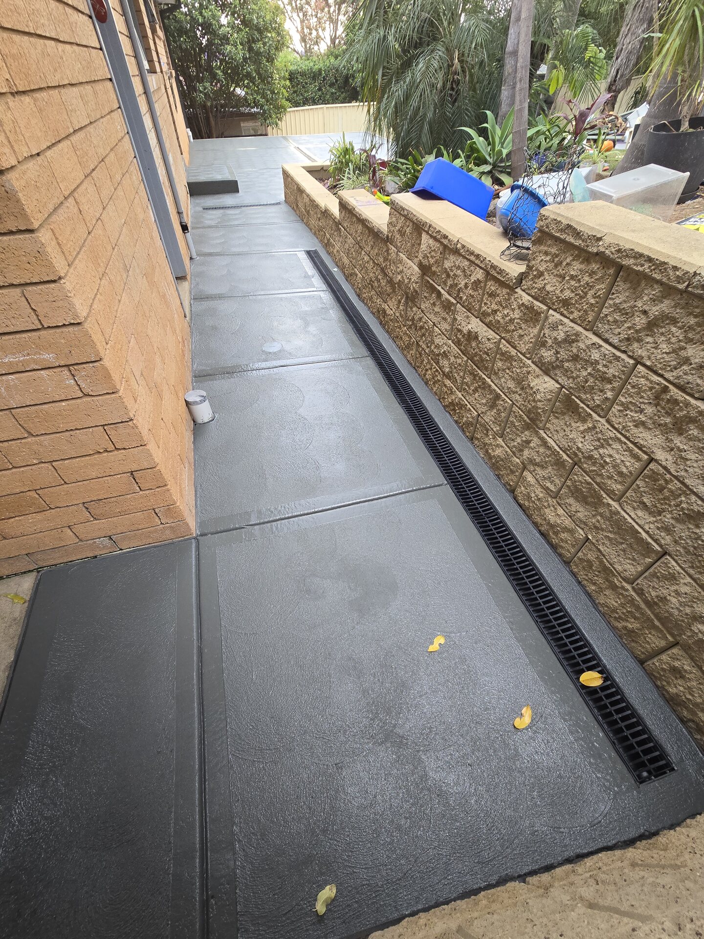 Completed concrete access path with continuous strip drainage installed by MTS
