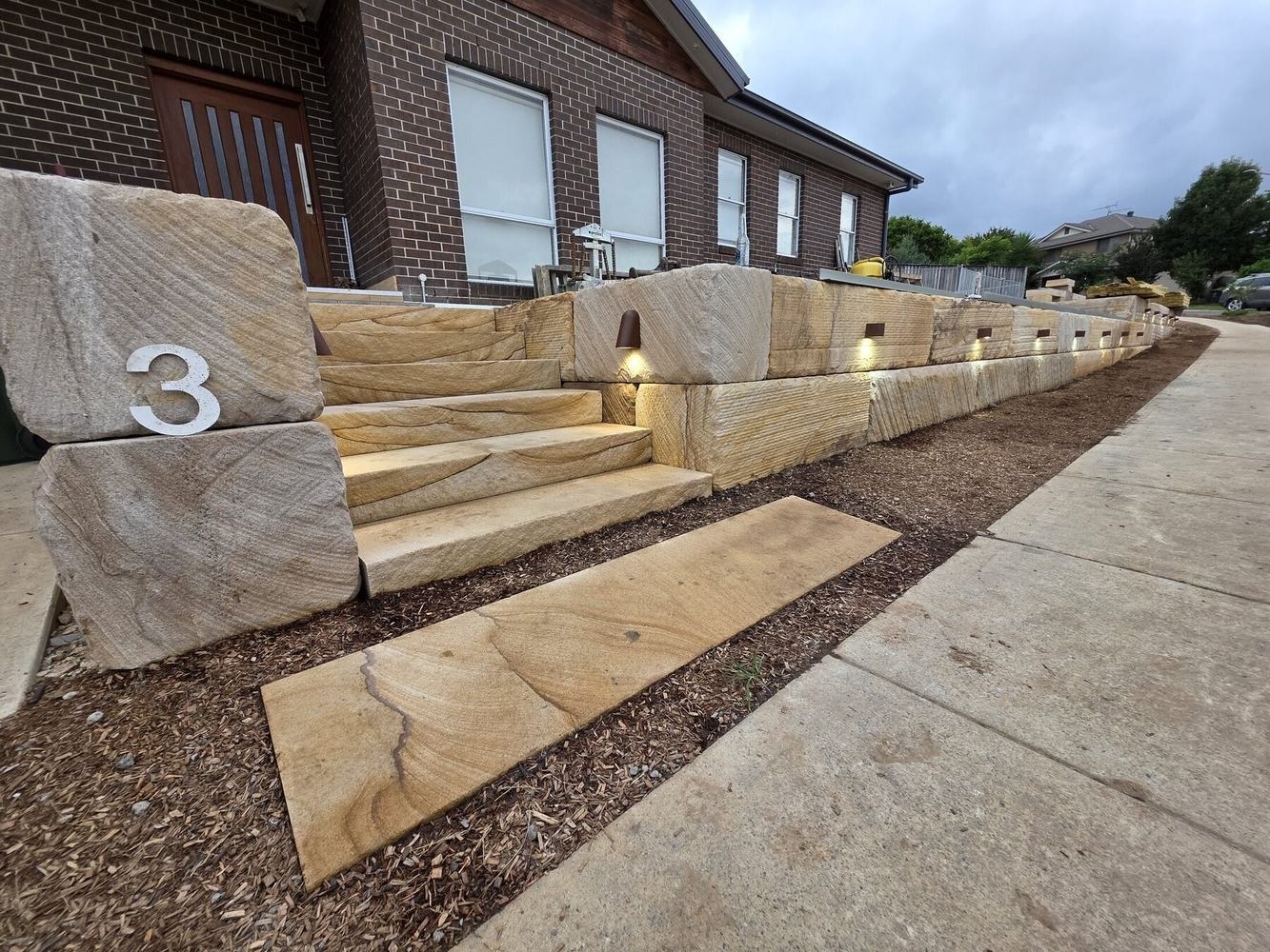Camden Acres sandstone retaining wall, lighting and diamond-sawn staircase completed by MTS