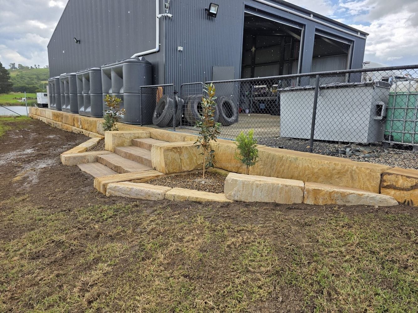 Completed sandstone staircase and garden beds