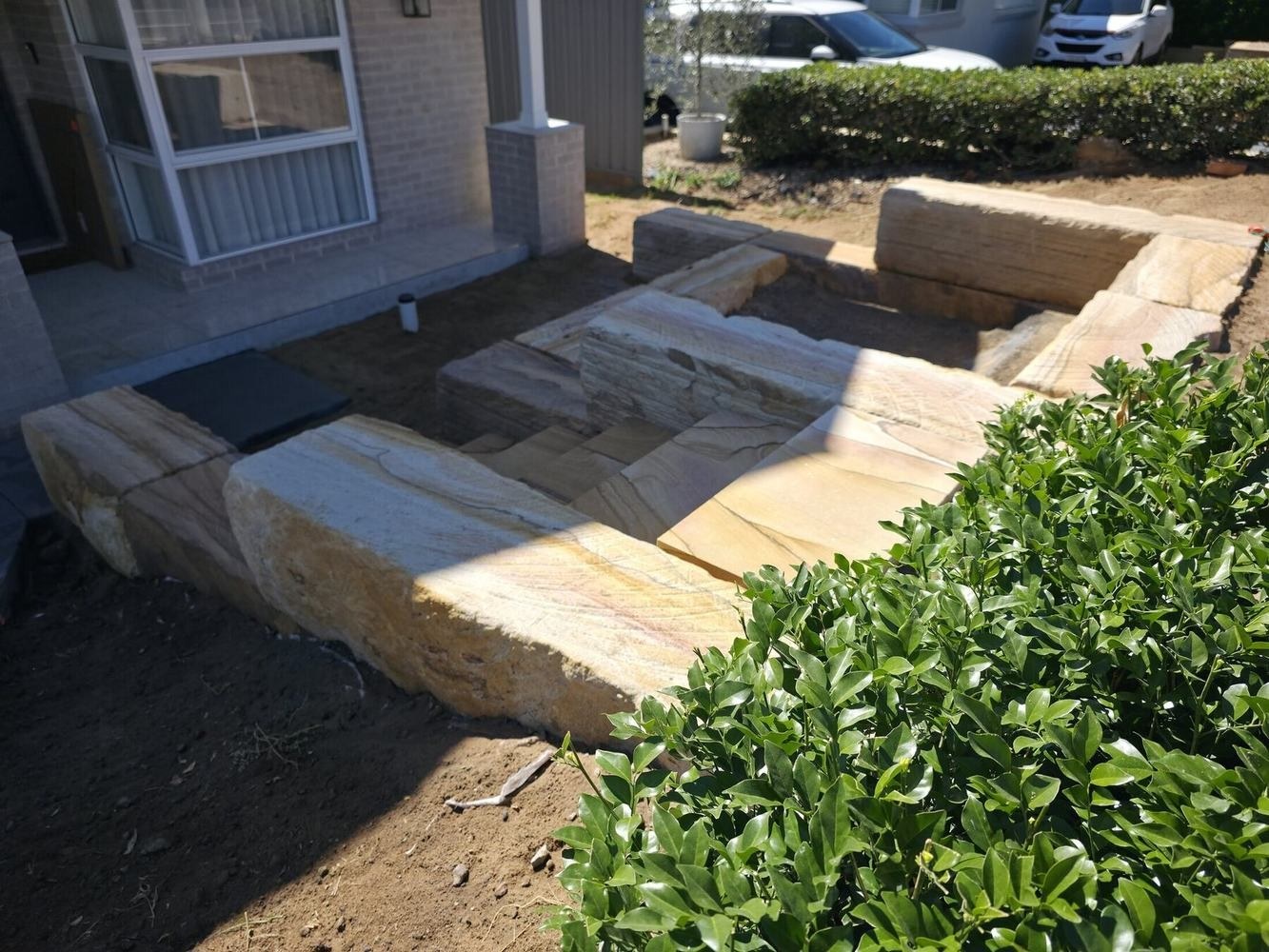 Completed sandstone wall and diamond-sawn staircase