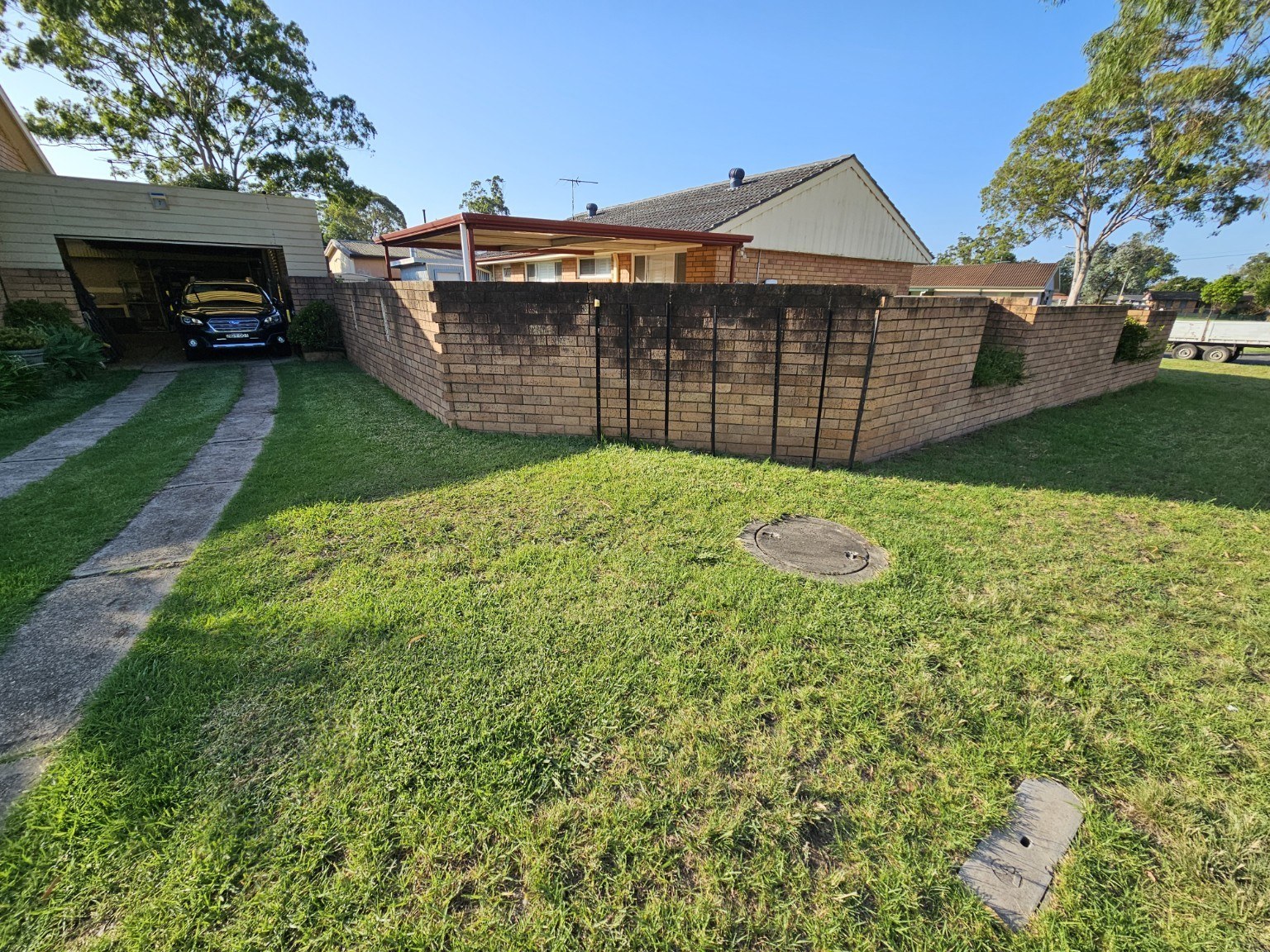 Failed brick wall with temporary bracing