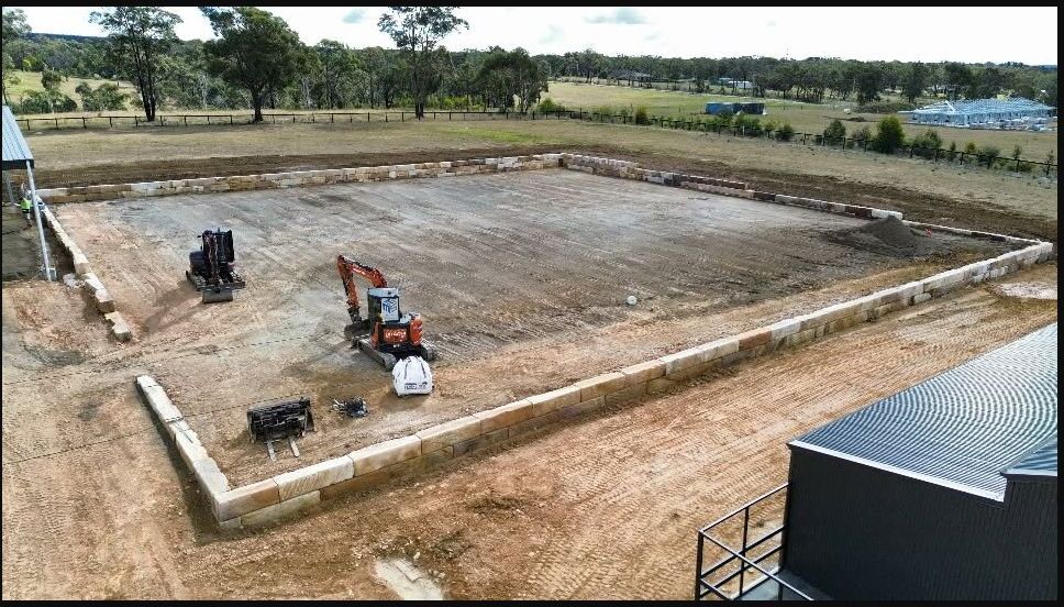 Moores Trades and Services machinery on a completed rural earthworks site